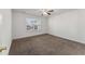 A well-lit bedroom showcases a window overlooking the outdoor landscape at 1905 Maple Sugar Ln, Fuquay Varina, NC 27526