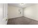 Cozy bedroom with neutral carpet, light walls, and a window providing natural light at 1905 Maple Sugar Ln, Fuquay Varina, NC 27526