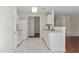 Clean kitchen with white cabinets and tile flooring, featuring stainless steel appliances at 1905 Maple Sugar Ln, Fuquay Varina, NC 27526
