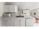 Bright kitchen features white cabinets, stainless steel appliances, and an open layout perfect for modern living at 1905 Maple Sugar Ln, Fuquay Varina, NC 27526