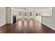 Bright living room with a fireplace, ceiling fan, hardwood floors, and lots of natural light at 1905 Maple Sugar Ln, Fuquay Varina, NC 27526