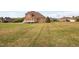 Backyard view of the deck and lawn at 21 W Paige Wynd Dr, Angier, NC 27501