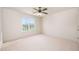 Bright, carpeted bedroom with a large window offering plenty of natural light at 21 W Paige Wynd Dr, Angier, NC 27501