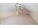 Large, versatile bonus room with angled ceilings and plush carpet at 21 W Paige Wynd Dr, Angier, NC 27501