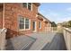 View of the deck area with brick house at 21 W Paige Wynd Dr, Angier, NC 27501