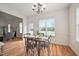 Dining area with natural light, hardwood floors, and seamless access to living room at 21 W Paige Wynd Dr, Angier, NC 27501