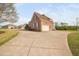 Exterior showcasing the garage and expansive driveway at 21 W Paige Wynd Dr, Angier, NC 27501