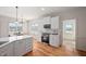 Open kitchen featuring white cabinetry, stainless steel appliances, and a charming breakfast nook at 21 W Paige Wynd Dr, Angier, NC 27501