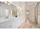 Main bathroom featuring double vanity, large mirror, and tile flooring at 21 W Paige Wynd Dr, Angier, NC 27501