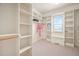Bright walk-in closet featuring custom shelving and natural light at 21 W Paige Wynd Dr, Angier, NC 27501