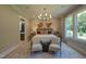 Bright and airy bedroom with modern furnishings, neutral decor, and access to an ensuite bathroom at 2108 New Hope Church Rd, Chapel Hill, NC 27514