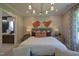 Serene bedroom showcasing stylish furnishings, neutral decor, and soft lighting with access to ensuite bath at 2108 New Hope Church Rd, Chapel Hill, NC 27514