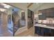 Bright kitchen with stainless steel appliances, a marble island with seating, and an open staircase nearby at 2108 New Hope Church Rd, Chapel Hill, NC 27514