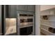 Built in double ovens and a walk-in pantry with custom shelving for storage at 2108 New Hope Church Rd, Chapel Hill, NC 27514
