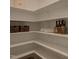 Walk-in pantry with white custom shelving at 2108 New Hope Church Rd, Chapel Hill, NC 27514