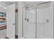 Clean bathroom features a glass-enclosed shower and white door to main bedroom at 211 Azalea Gaze Dr, Youngsville, NC 27596