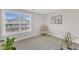 Spare bedroom featuring a large window and neutral walls and soft carpet at 211 Azalea Gaze Dr, Youngsville, NC 27596