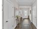 Elegant foyer featuring hardwood floors, stylish decor, and a welcoming atmosphere at 211 Azalea Gaze Dr, Youngsville, NC 27596