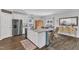 Spacious kitchen features granite countertops, stainless appliances, and a charming dining room at 211 Azalea Gaze Dr, Youngsville, NC 27596