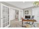 Bright office space with French doors and neutral paint at 211 Azalea Gaze Dr, Youngsville, NC 27596