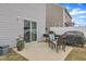 Cozy patio area with outdoor furniture, potted plants, and sliding door access at 211 Azalea Gaze Dr, Youngsville, NC 27596