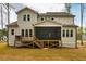 Back exterior of home with wood deck and screened porch at 215 Bonterra Way, Chapel Hill, NC 27516