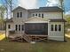 Back of home with wood deck and screened-in porch at 215 Bonterra Way, Chapel Hill, NC 27516