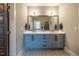 Well-lit bathroom boasts double vanity, stylish mirrors, and modern fixtures at 215 Bonterra Way, Chapel Hill, NC 27516