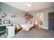 Bright bedroom featuring playful decor, neutral gray walls, and cozy carpeting at 215 Bonterra Way, Chapel Hill, NC 27516