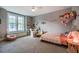 Inviting bedroom featuring large windows, plush carpeting, and comfortable window seating at 215 Bonterra Way, Chapel Hill, NC 27516