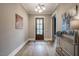 Inviting foyer featuring hardwood floors, neutral walls, and an elegant front door at 215 Bonterra Way, Chapel Hill, NC 27516