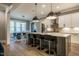 Open concept kitchen and dining room featuring an island with seating and modern appliances at 215 Bonterra Way, Chapel Hill, NC 27516