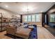 This living room features a large sectional, a blue area rug and a large window view at 215 Bonterra Way, Chapel Hill, NC 27516
