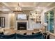 Bright living room featuring a fireplace, built-in shelving, coffered ceilings and modern decor at 215 Bonterra Way, Chapel Hill, NC 27516