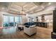 Open-concept living room with coffered ceilings, hardwood floors, and a gourmet kitchen at 215 Bonterra Way, Chapel Hill, NC 27516