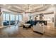 Bright living room with hardwood floors, coffered ceilings, and seamless access to an outdoor patio at 215 Bonterra Way, Chapel Hill, NC 27516