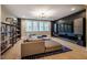 This living room features a large sectional, a blue area rug, and a dark accent wall at 215 Bonterra Way, Chapel Hill, NC 27516