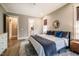 This bedroom has a calming color scheme and a view of the bathroom and the closet at 215 Bonterra Way, Chapel Hill, NC 27516