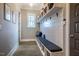 Convenient mudroom featuring a built-in bench with storage and coat hooks for organization at 215 Bonterra Way, Chapel Hill, NC 27516