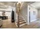 Inviting foyer featuring a staircase with hardwood treads and white risers leading to the upper level at 215 Bonterra Way, Chapel Hill, NC 27516