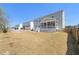 Spacious backyard featuring a patio and a well-manicured lawn at 216 Ocean Jasper Dr, Holly Springs, NC 27540