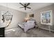 Cozy bedroom featuring a unique hammock chair, carpet floors and natural light from two windows at 216 Ocean Jasper Dr, Holly Springs, NC 27540