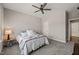 Neutral bedroom with a ceiling fan, and carpet at 216 Ocean Jasper Dr, Holly Springs, NC 27540