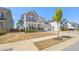 Two-story home with a well-manicured lawn and a three-car garage at 216 Ocean Jasper Dr, Holly Springs, NC 27540