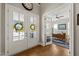 Elegant foyer leading to a bright office through French doors, with a welcoming view to the front at 216 Ocean Jasper Dr, Holly Springs, NC 27540