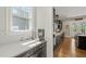 Modern kitchen with sleek countertops, dark cabinets, and stainless steel appliances at 216 Ocean Jasper Dr, Holly Springs, NC 27540