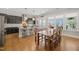 Eat-in kitchen boasts a dining table and an island with barstool seating at 216 Ocean Jasper Dr, Holly Springs, NC 27540
