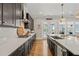 Modern kitchen with stainless steel appliances, white countertops and view of balcony at 216 Ocean Jasper Dr, Holly Springs, NC 27540
