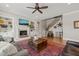 Inviting living room features a fireplace, built-in shelving, and a cozy seating area at 216 Ocean Jasper Dr, Holly Springs, NC 27540