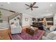 Open-concept living room with view of kitchen and staircase, featuring hardwood floors and stylish decor at 216 Ocean Jasper Dr, Holly Springs, NC 27540